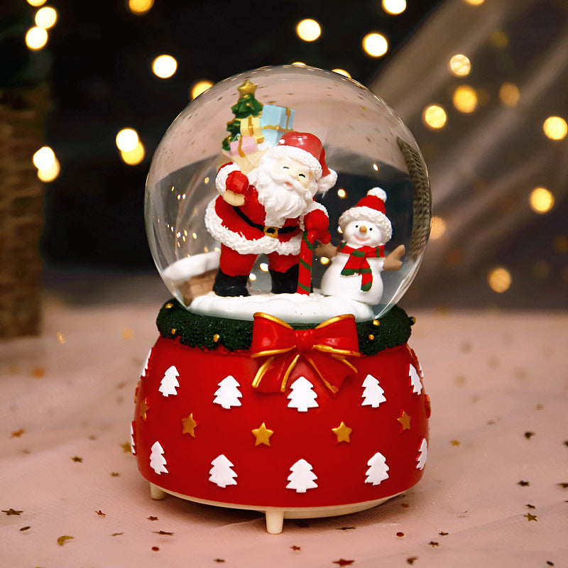 Santa and snowman globe on a red patterned base