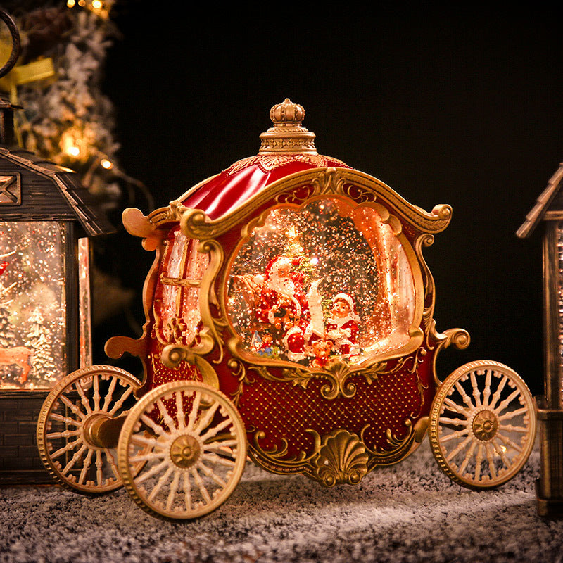Lighted red carriage snow globe