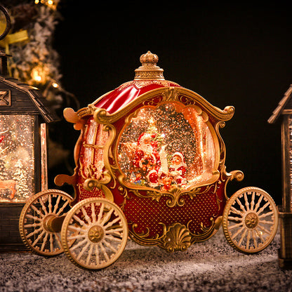 Lighted red carriage snow globe