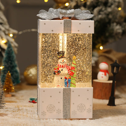 White gift box decoration with snowman scene