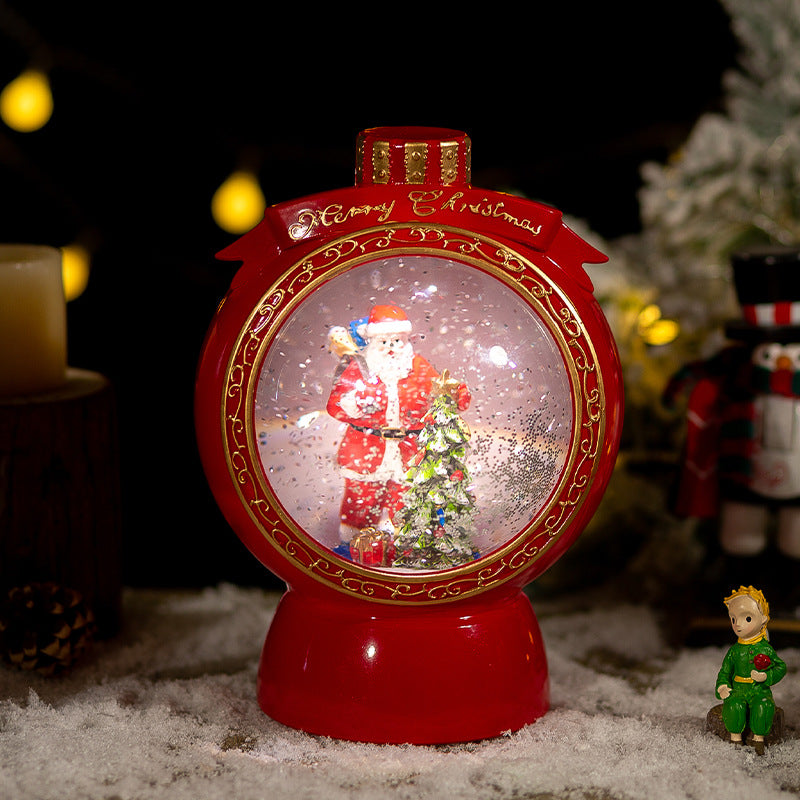Red round snow globe with Santa scene