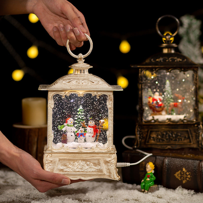 Hand holding a white Christmas lantern with a cable