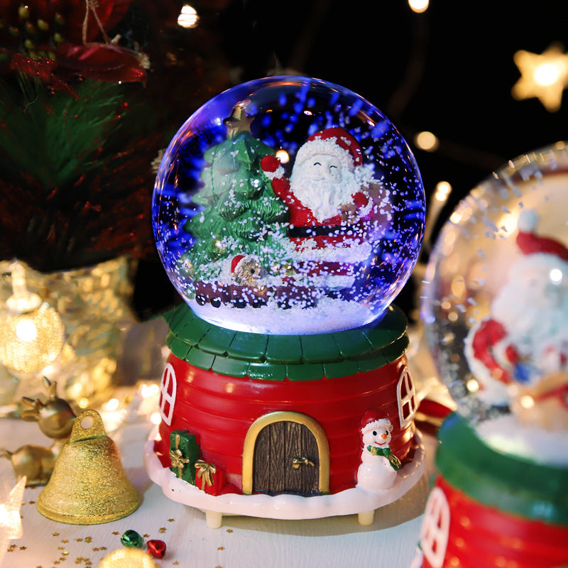 Snow globe with green house-style base