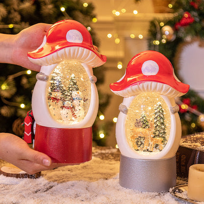 Hand holding a mushroom Christmas snow globe