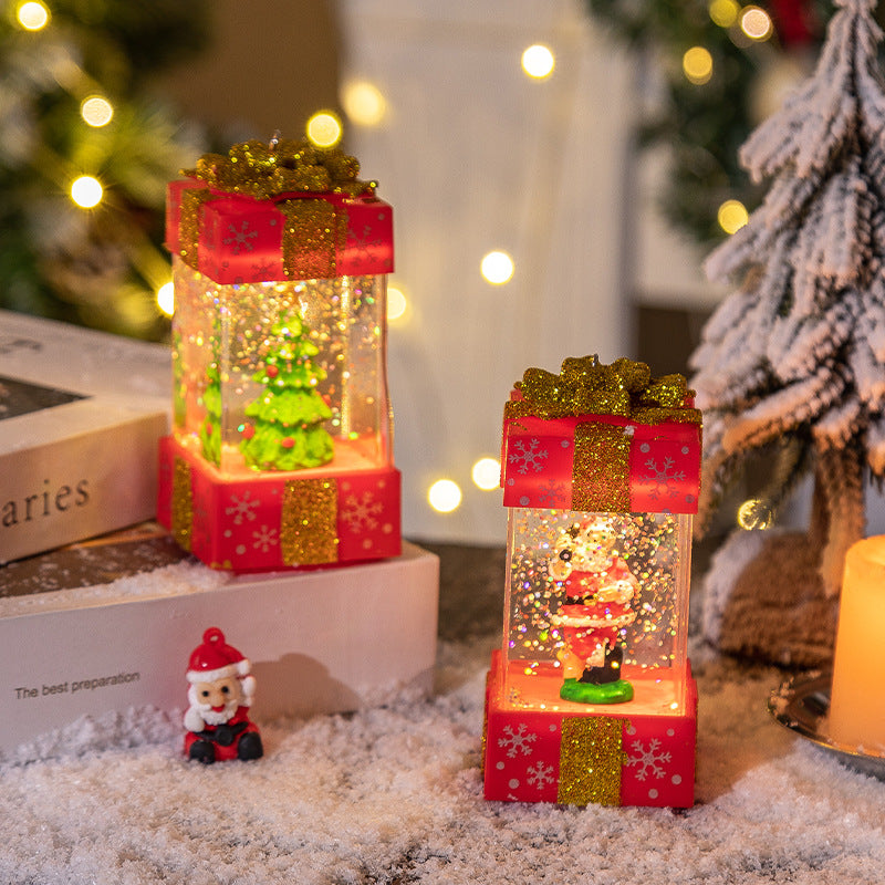 Red and white present-shaped snow globes