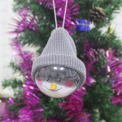 Gray-hat snowman ornament hanging on a tree