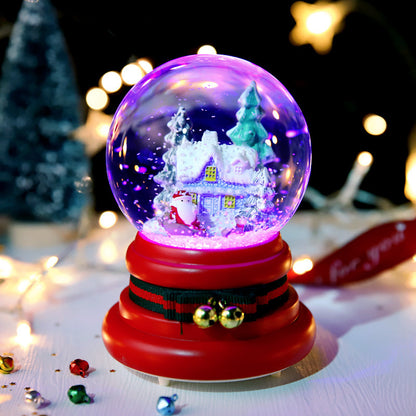 Illuminated village globe on a red Santa-belt base