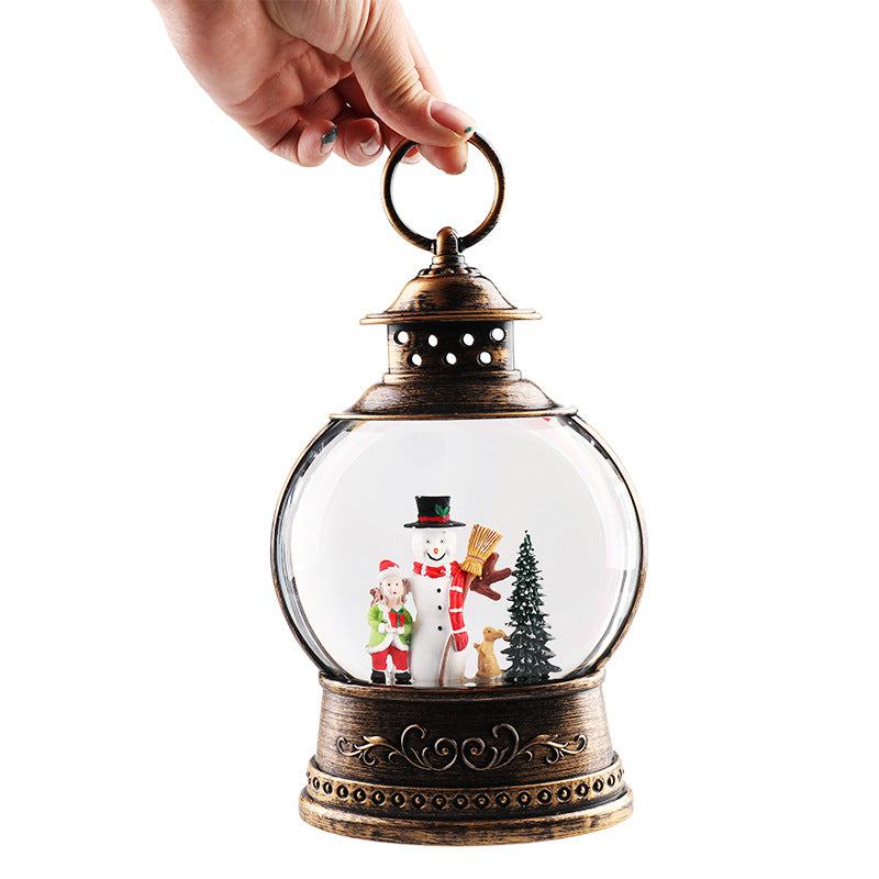 Hand holding a round snowman lantern