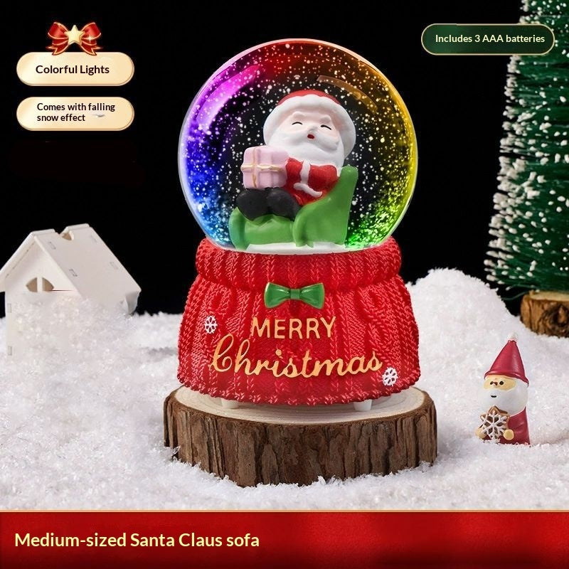 Medium Santa on a sofa snow globe