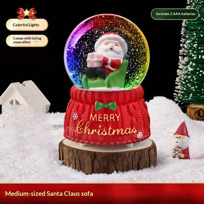 Medium Santa on a sofa snow globe