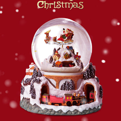 Christmas village snow globe with Santa and train base