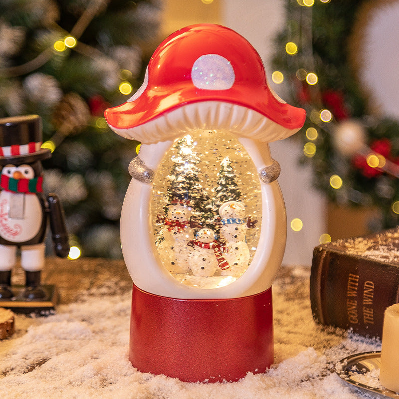 Snowman scene inside a red mushroom snow globe