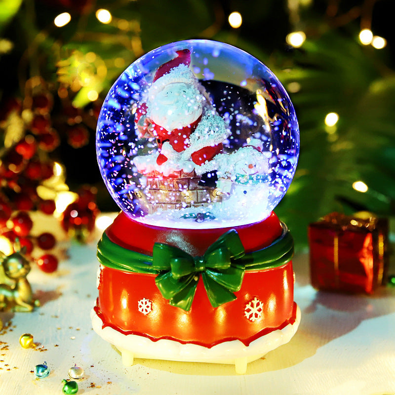 Illuminated Santa scene on red gift-shaped base
