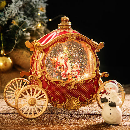 Red Christmas carriage snow globe with gold-tone wheels