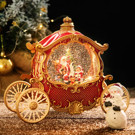Red Christmas carriage snow globe with gold-tone wheels