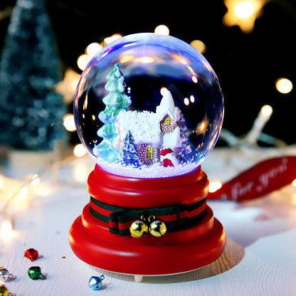 Snowy village globe on red Santa-belt base