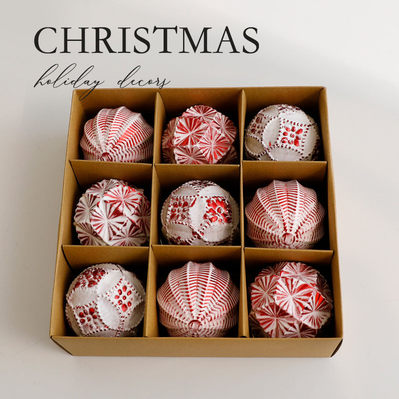 Rose gold-tone baubles in a holiday display