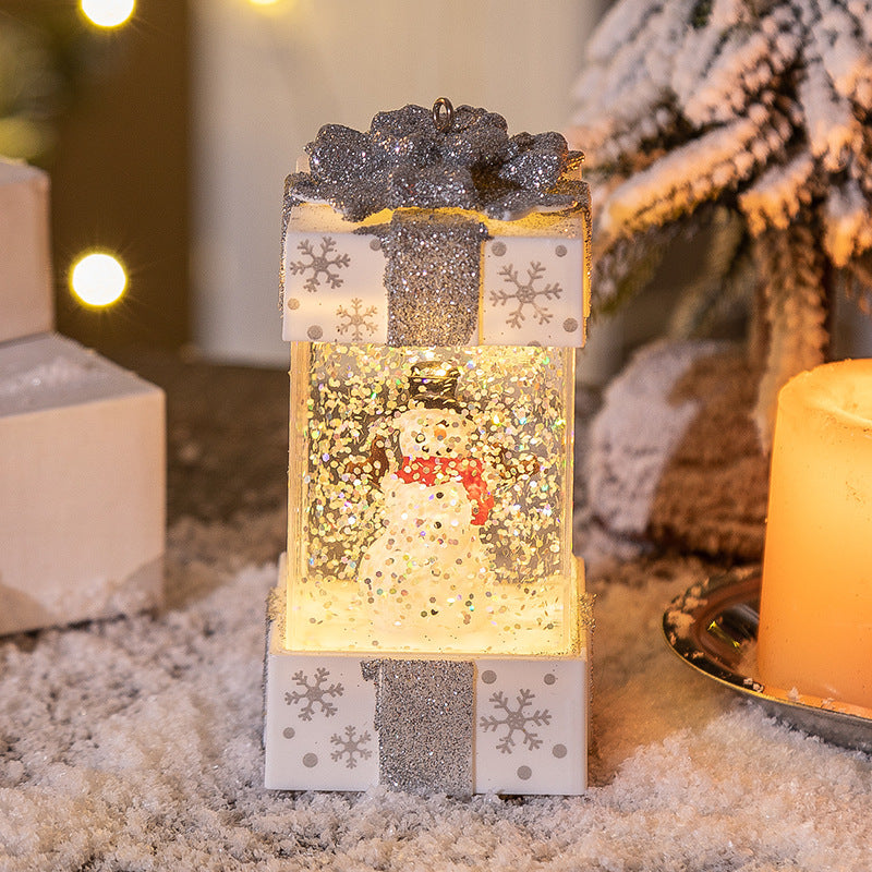 Tall white gift box snow globe