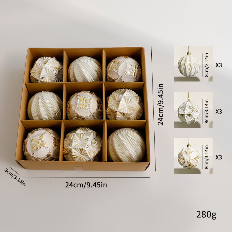 Gold-tone patterned baubles in a divided box