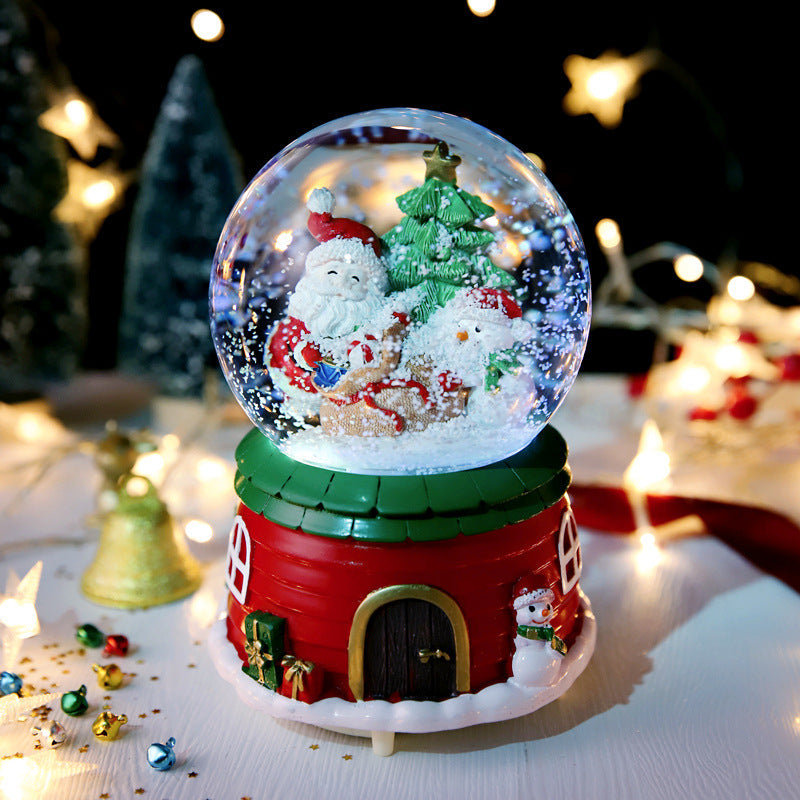 Winter scene globe on a green house-style base