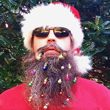 Adult wearing small Christmas beard ornaments