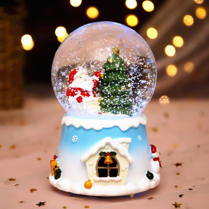 Santa and tree globe on a pale blue house base