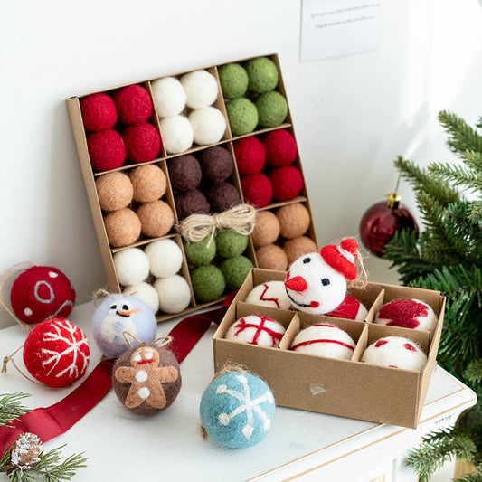 Boxes of felt ball ornaments with holiday decorations