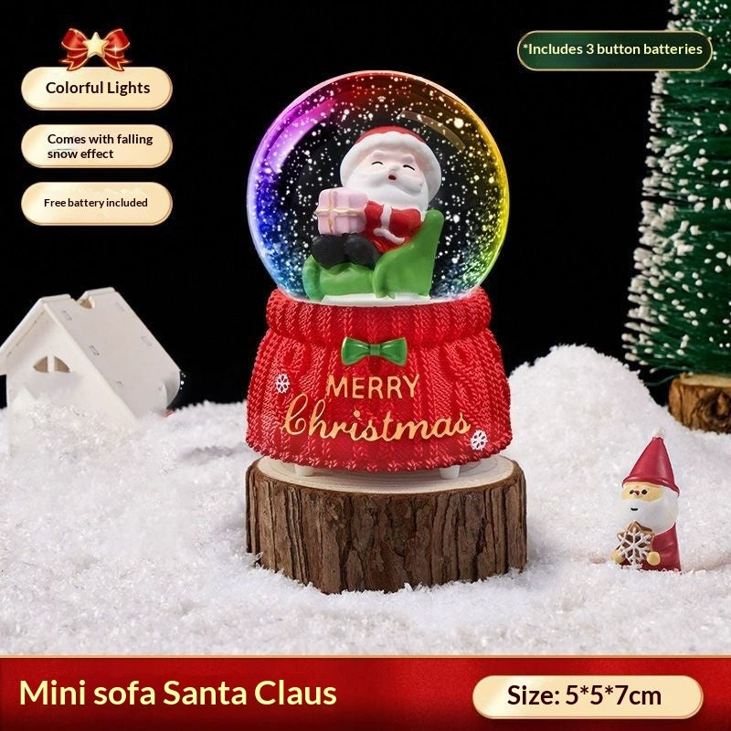 Mini Santa on a sofa snow globe