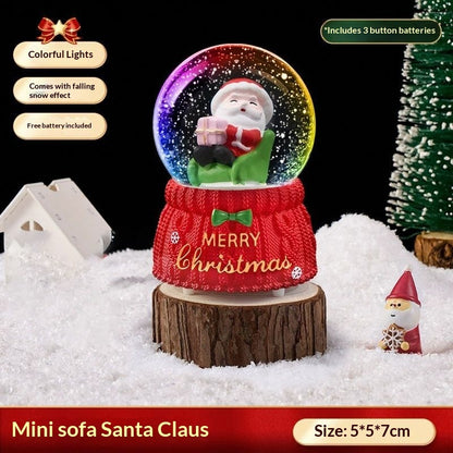 Mini Santa on a sofa snow globe