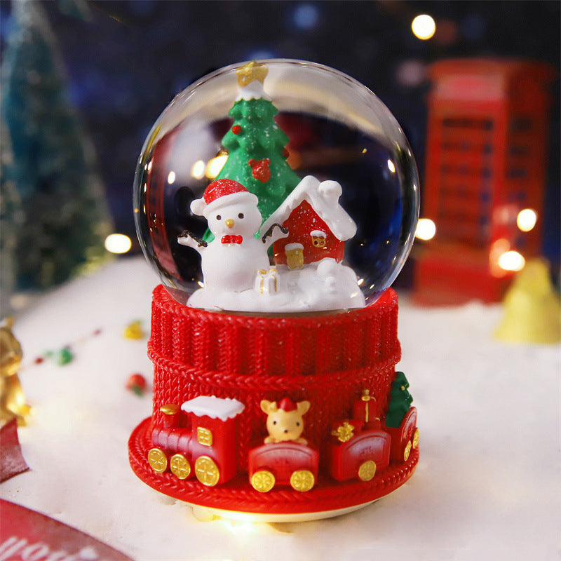 Snowman and house globe on a red knit-style base
