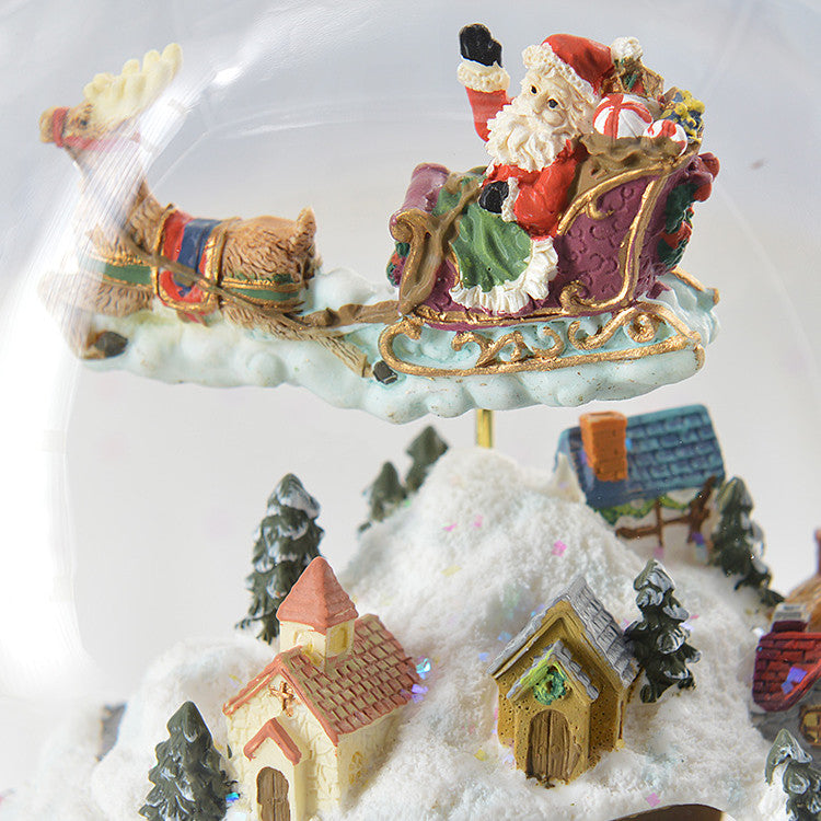 Close-up of Santa sleigh and village details