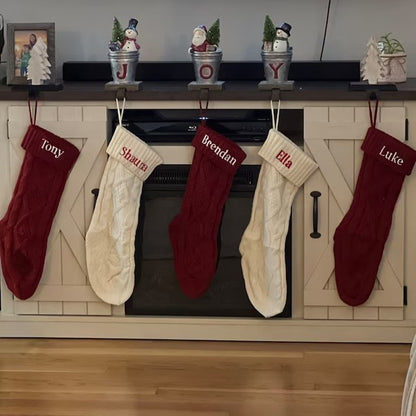 Knit stockings arranged across a mantel