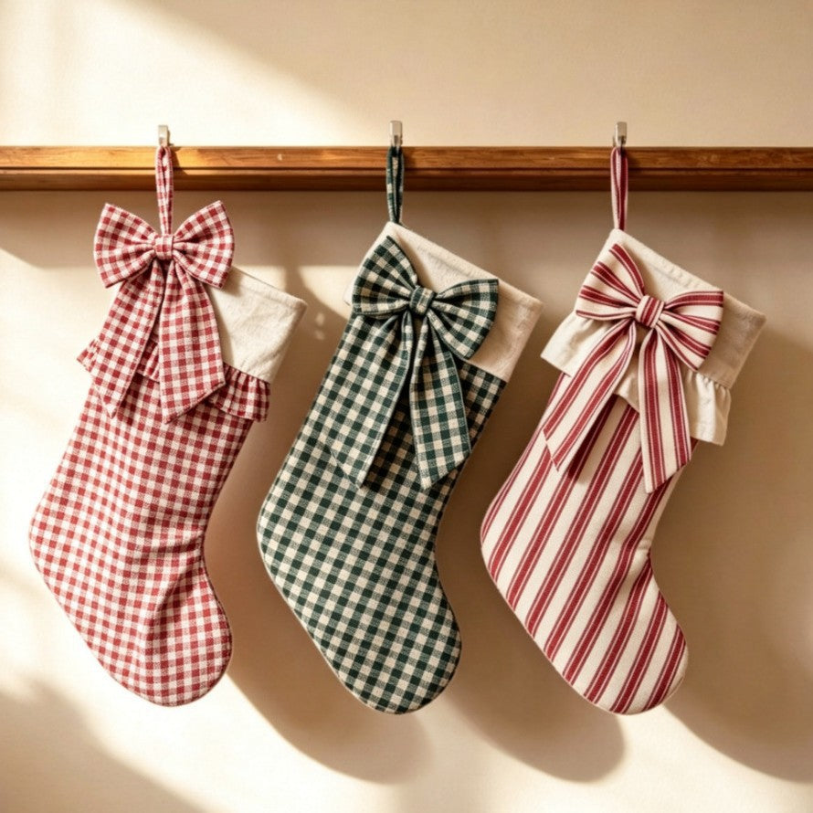 Plaid and striped bow Christmas stockings hanging together