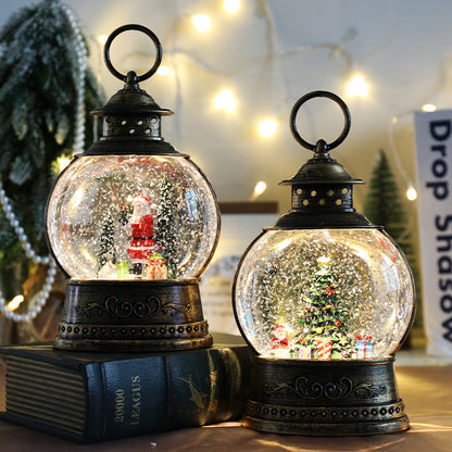 Christmas lantern snow globes displayed together