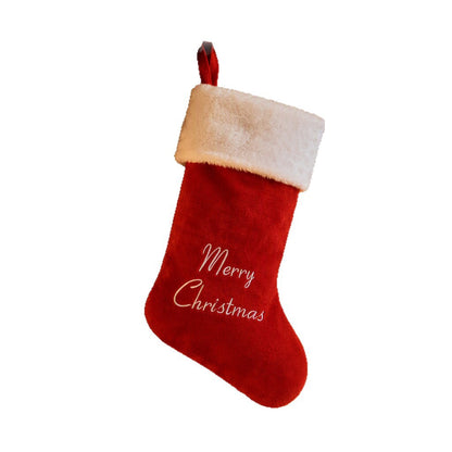 Red Merry Christmas stocking on a white background
